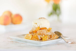 Read more about the article Grandma Bertha’s Peach Cobbler